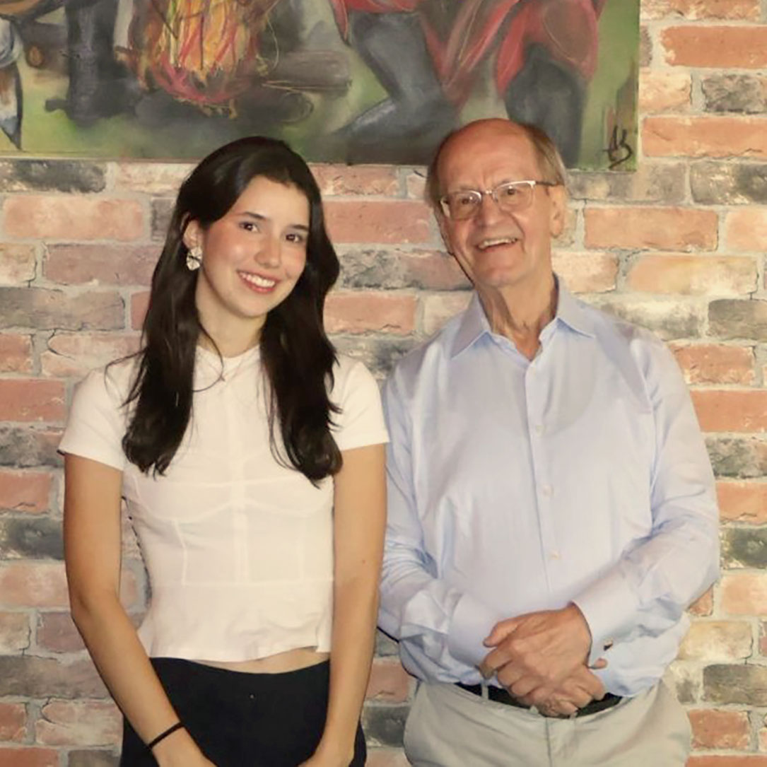 DCE Global Partner Student Alice C. poses for a photo with her instructor.