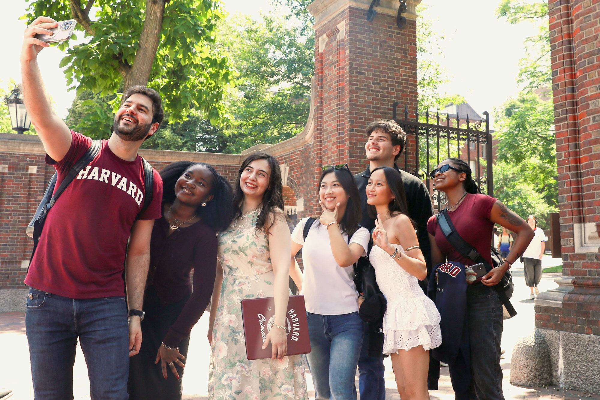 A group of DCE Global Harvard Summer School students pose for a selfie.